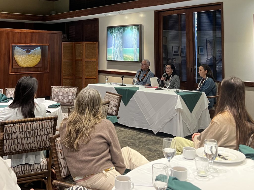 The 3 speakers at the front of the room and 3 audience members.